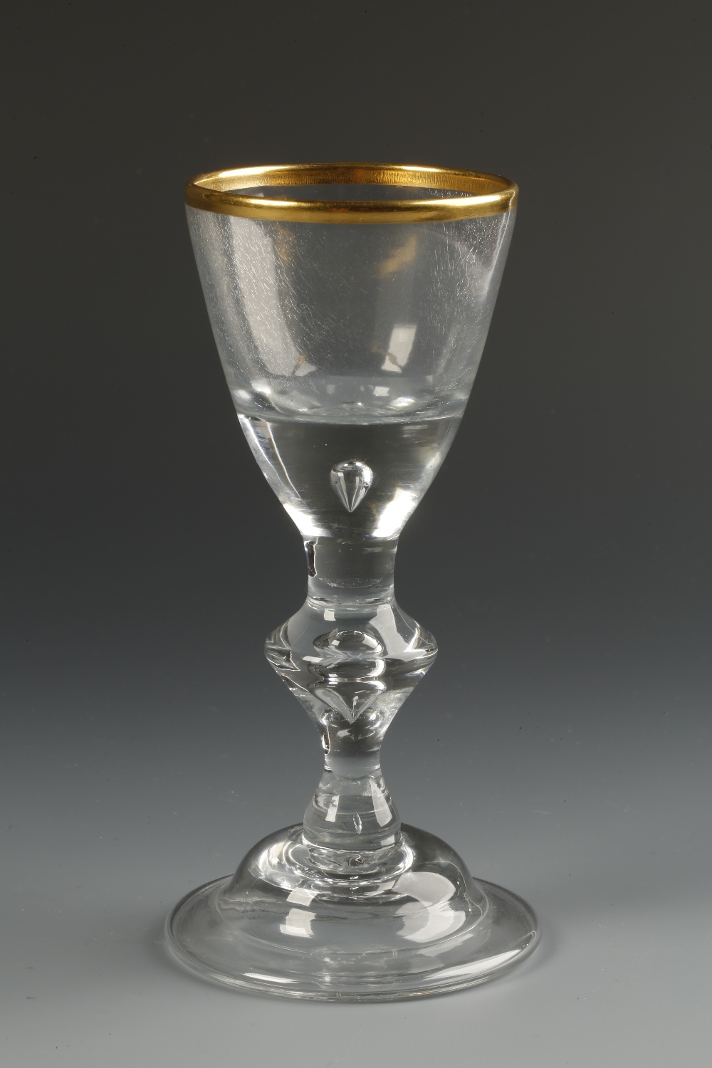 LOWENSTEIN OF HANOVER: A MID 18TH CENTURY WINE GLASS with straight-sided bowl with gilt rim and