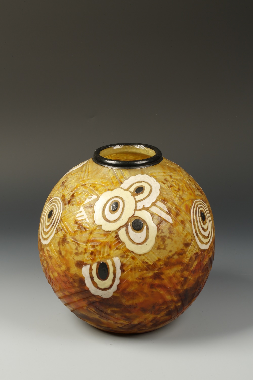 DELATTE, NANCY: AN OVOID ART DECO STYLE VASE with an orange and yellow mottled ground with enamel