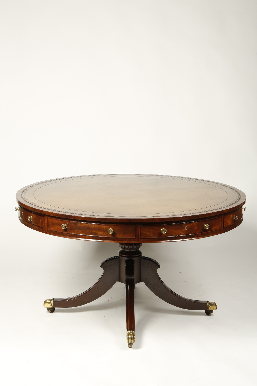 A LATE REGENCY MAHOGANY DRUM-TOP LIBRARY TABLE, the circular top with leather-lined writing