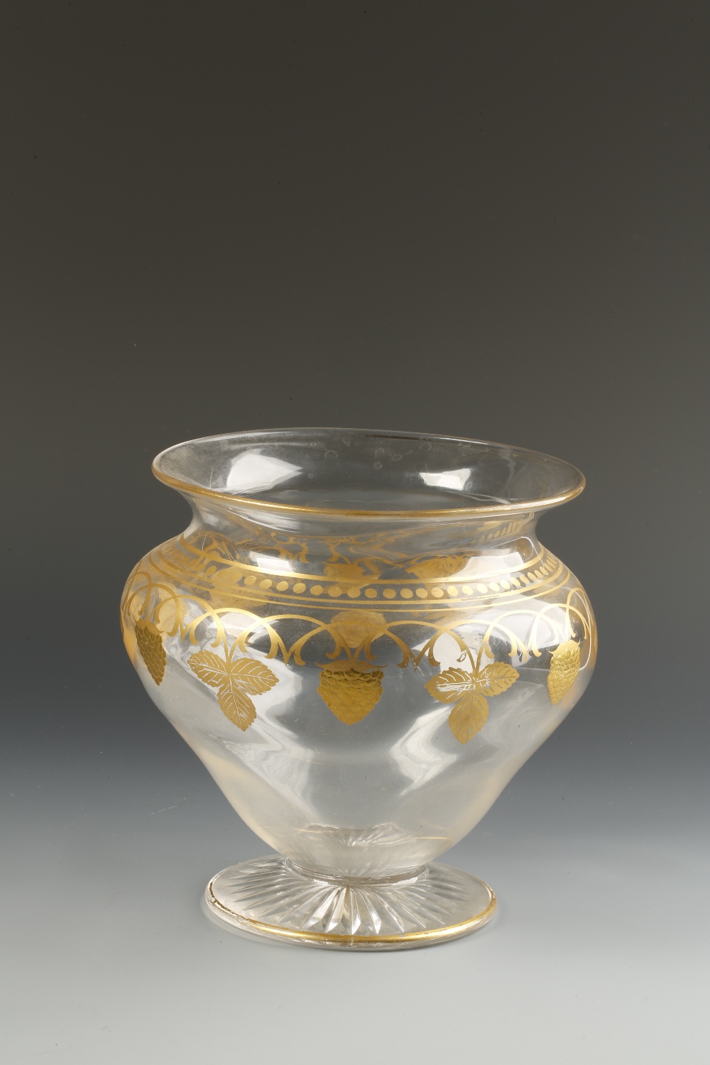 A VICTORIAN CLEAR AND GILT GLASS "STRAWBERRY" BOWL of bellied shouldered form, decorated in gilt