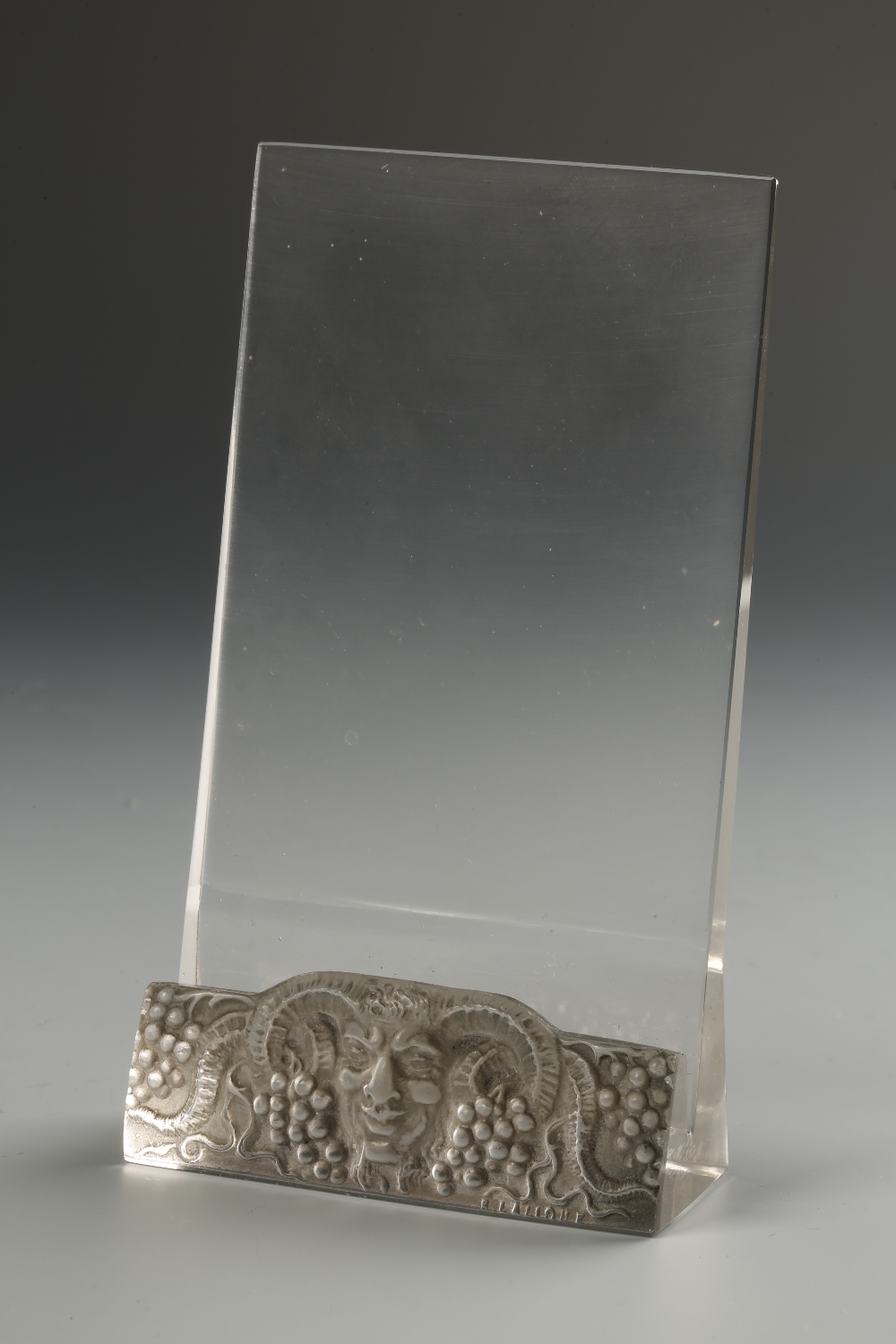 LALIQUE: "FAUNE" A clear glass menu card holder, the base with cast decoration and signature, 5.52