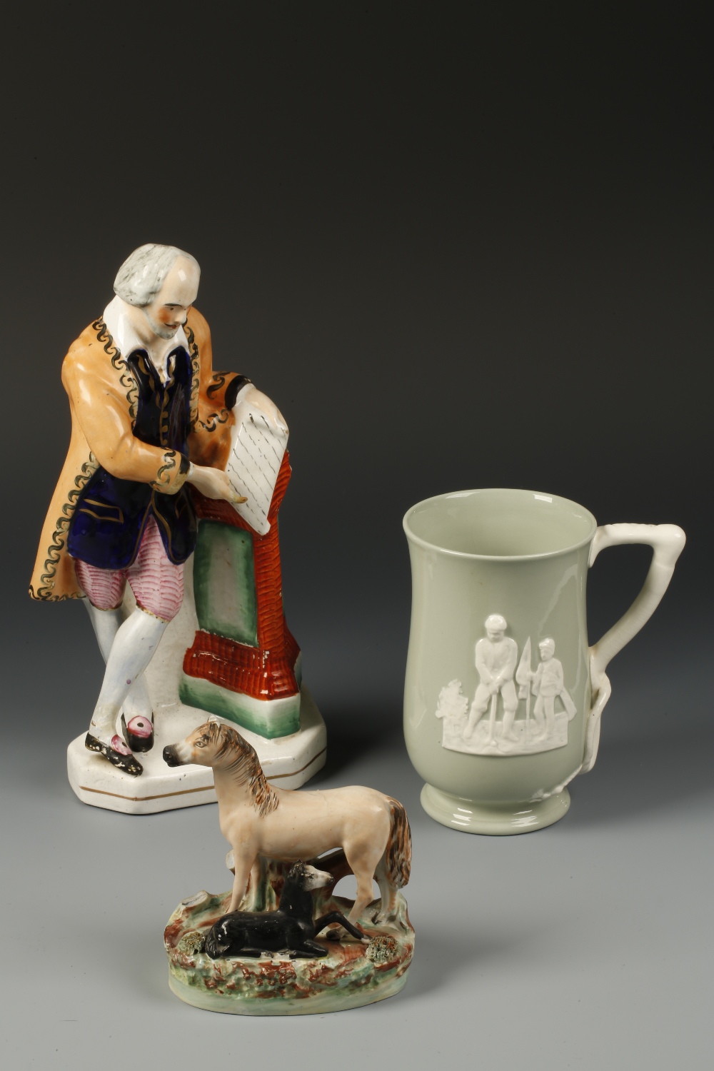A COPELAND SPODE TANKARD decorated in relief with a boy golfing with his father, with harp-shaped