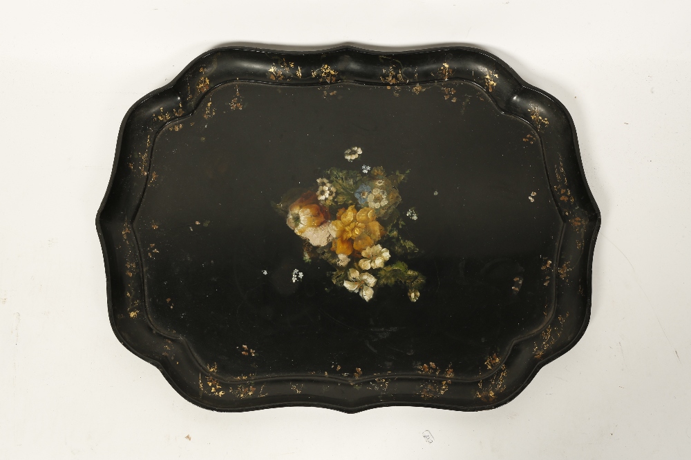 JENNENS AND BETTRIDGE: A PAPIER MACHE TRAY of cartouche shape with a raised border and a central