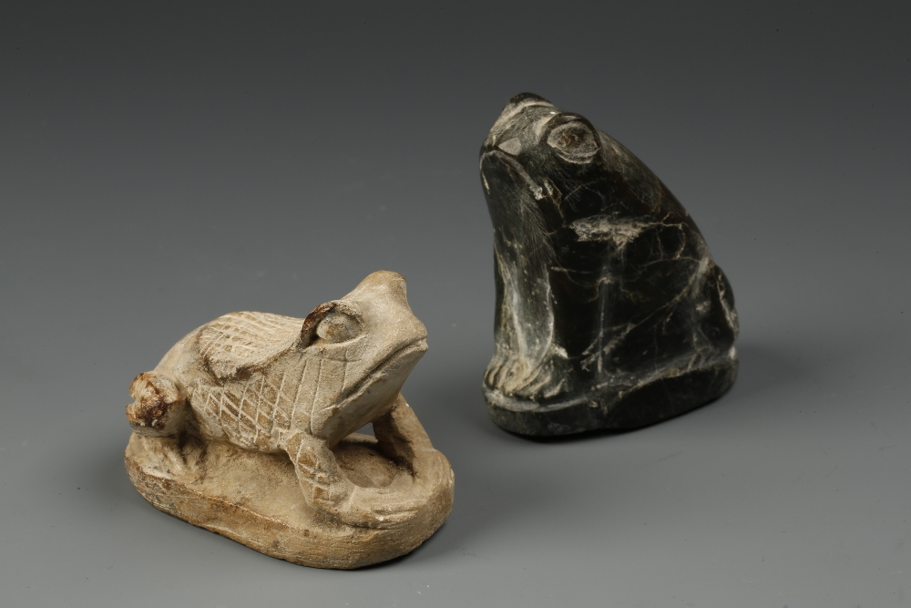 TWO EGYPTIAN STONE FROG ORNAMENTS, possibly Ancient, one in a lighter stone with cross-hatched