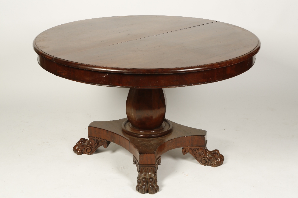 A VICTORIAN CIRCULAR TOP EXTENDING DINING TABLE, the top with moulded border on a bulbous column and
