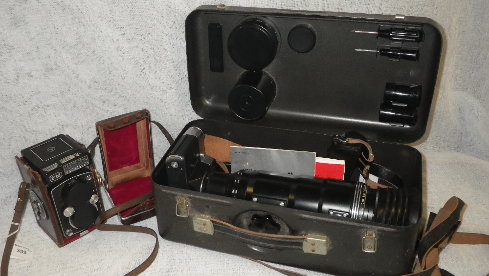 A Yashica Copal-MXV Camera in leather case and a `Zenit-ES Camera with long lens and accessories
