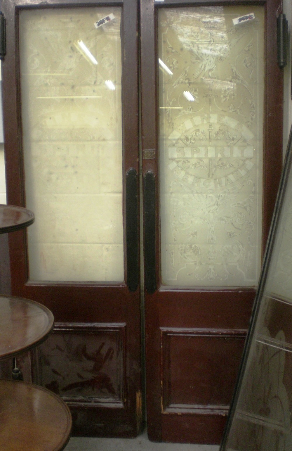 A pair of Victorian doors with large etched glass panels `Wine & Spirit Merchant` amongst exotic