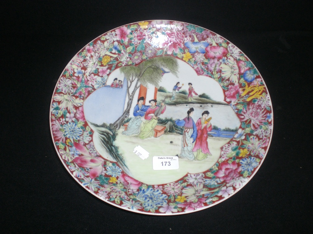 A Chinese Export charger decorated with figures in a landscape