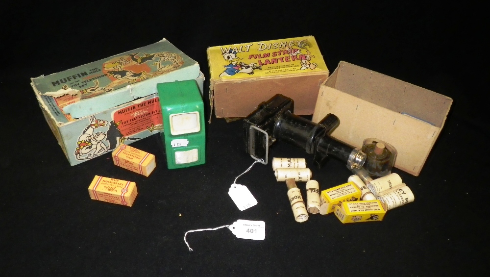 A Muffin the Mule toy television set in box and a Walt Disney film strip lantern