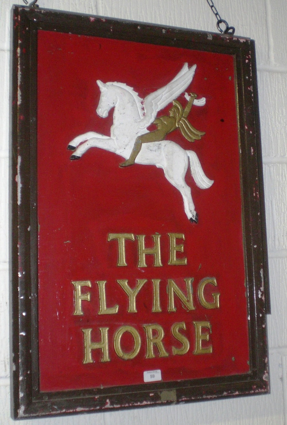 A double-sided hanging pub sign `The Flying Horse`