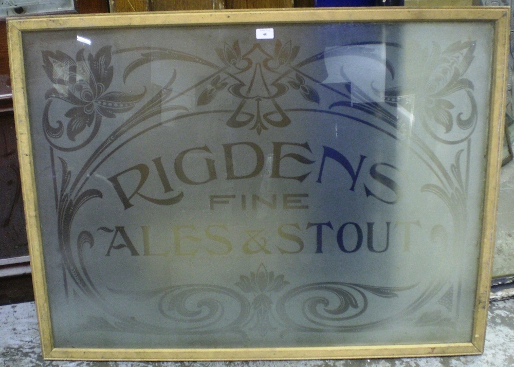A large etched pub window `Rigden`s Fine Ales and Stouts`