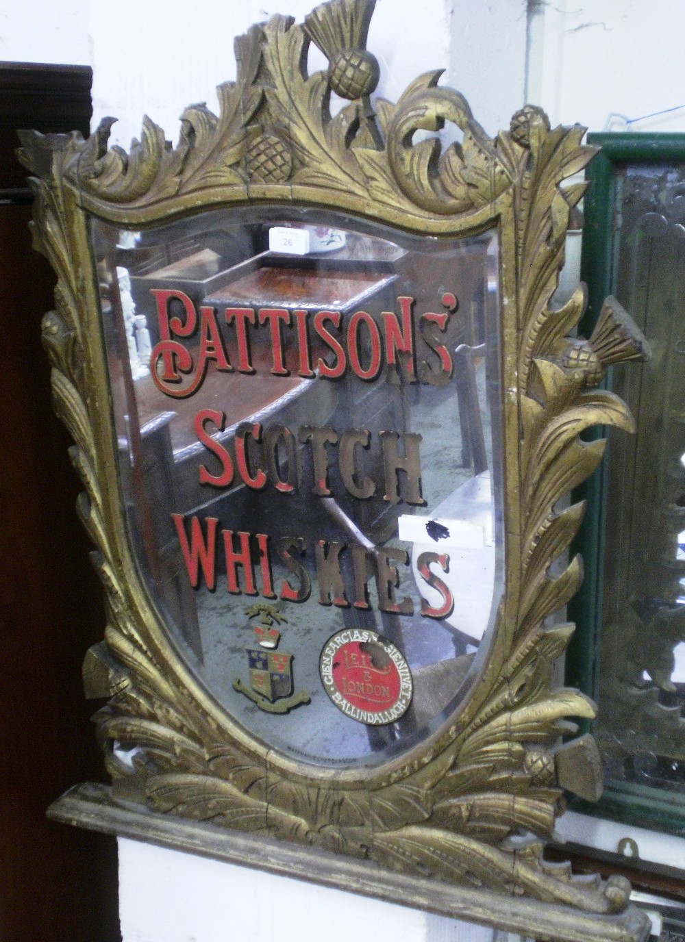 A Scottish pub mirror `Pattison`s Scotch Whiskies`, by Macphail & Co Ltd, Glasgow within a thistle