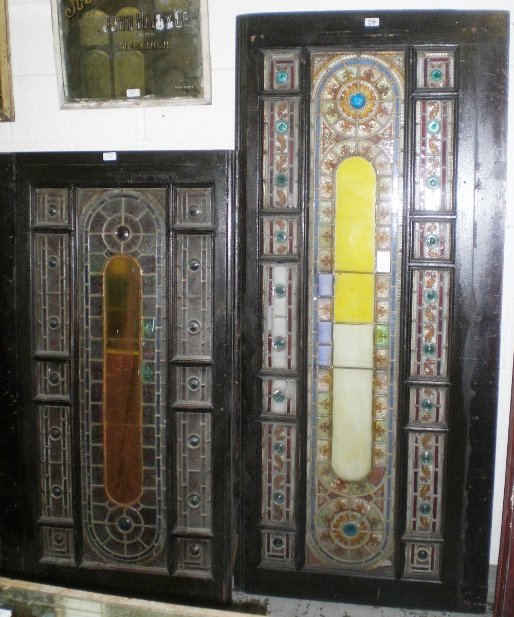 A near pair of Victorian windows with stained and leaded panes