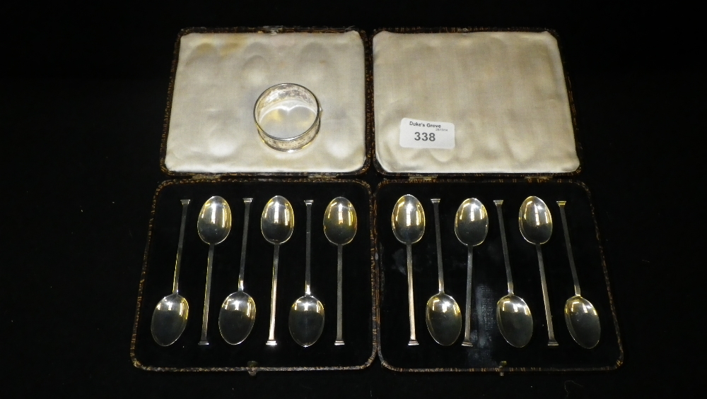 Two sets of silver seal-top type teaspoons, cased and an engraved silver napkin ring (3)