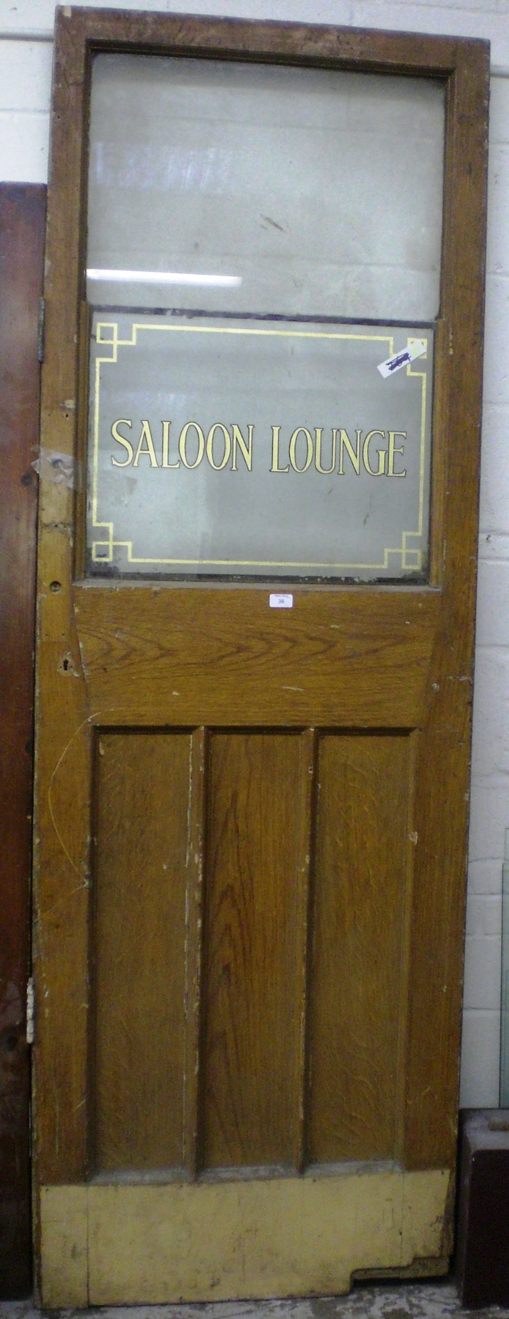 A Victorian pub door with a decorative panel `Saloon Lounge`