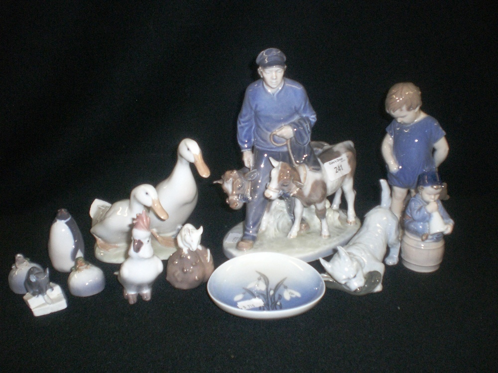 A collection of assorted Royal Copenhagen figures including animals, children and other subjects