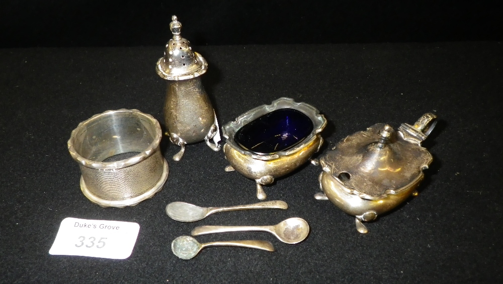 A three piece silver miniature condiment set and an engine-turned silver napkin ring