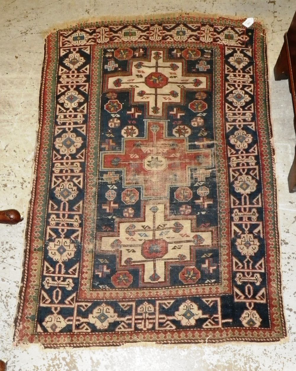 A dark blue ground Persian rug 48" x 32"
