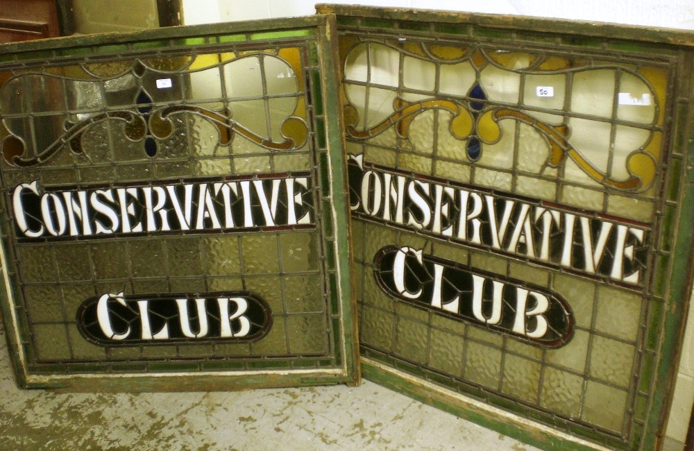 Two leaded glass windows with decorative lettering `Conservative Club`, within an Art Nouveau