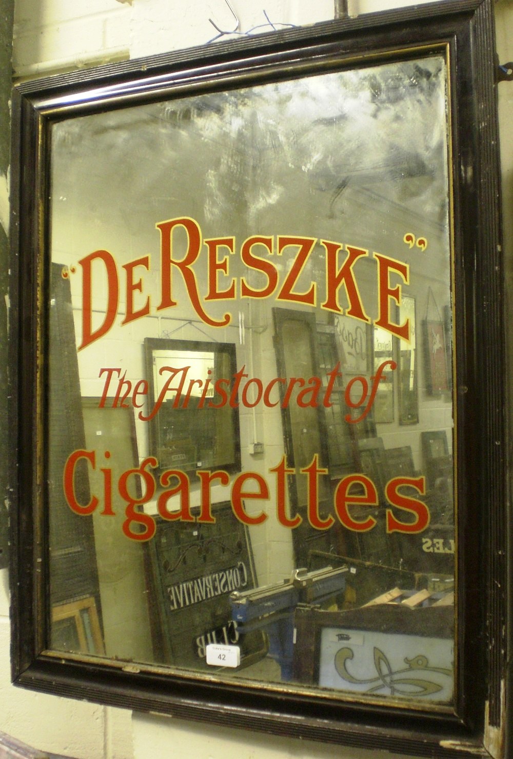 A pub mirror `Derezke, The Aristocrat of Cigarettes`