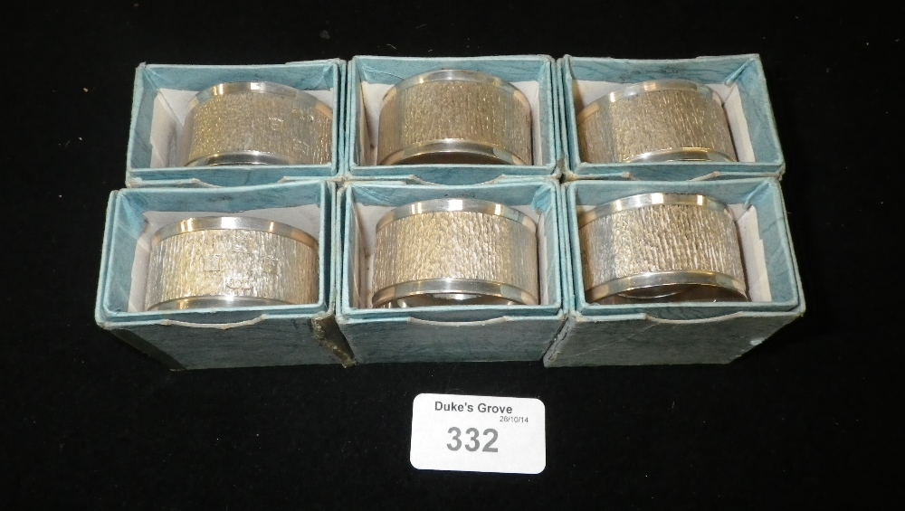 A set of six textured modern silver napkin rings, circa 1972, each with individual boxes