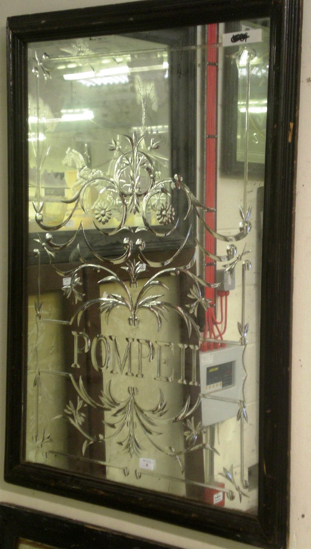 A Victorian pub mirror `Pompeii` within a scrolling surround