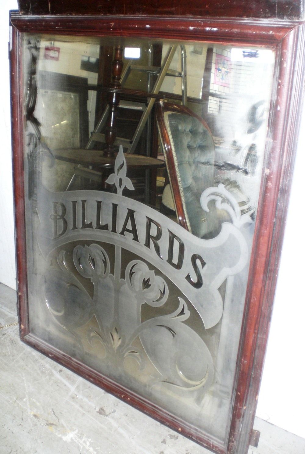 A Victorian cut and etched mirror `Billiards`, within a scrolling Art Nouveau surround