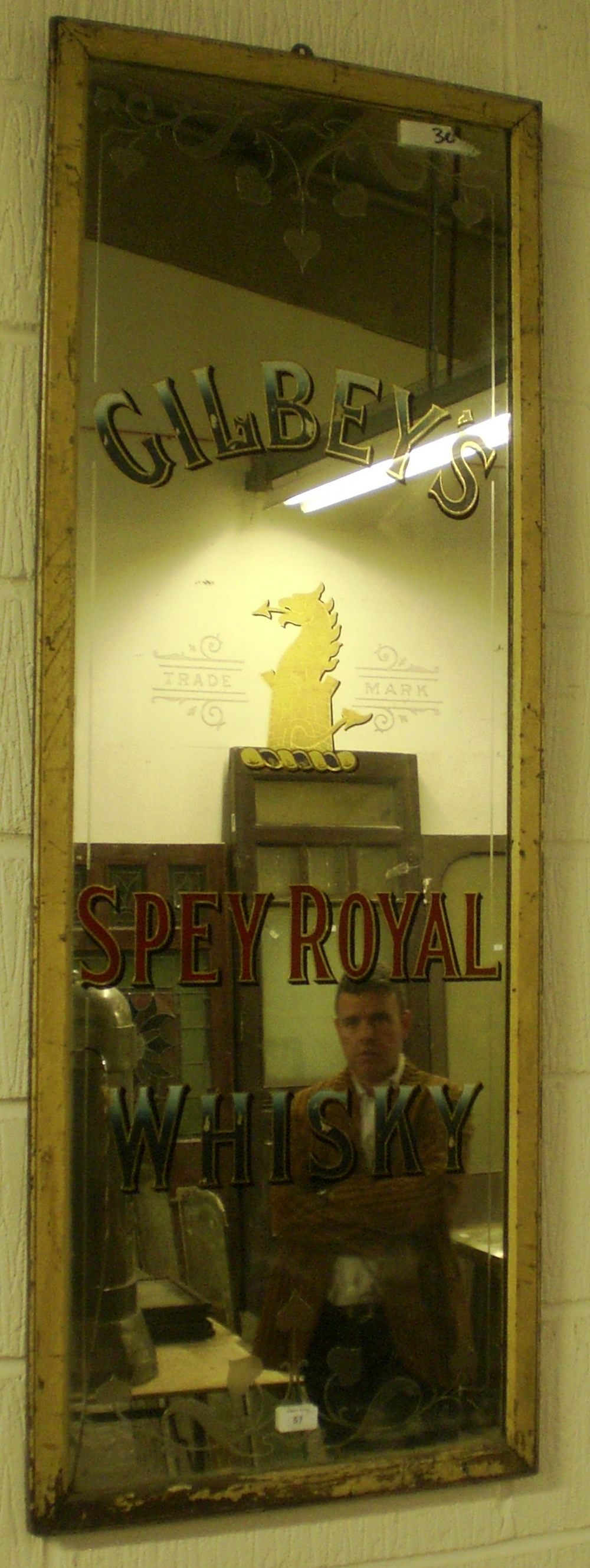 A large pub mirror `Gilbey`s Spay Royal Whisky` by J. G. Proudfoot, Edinb.