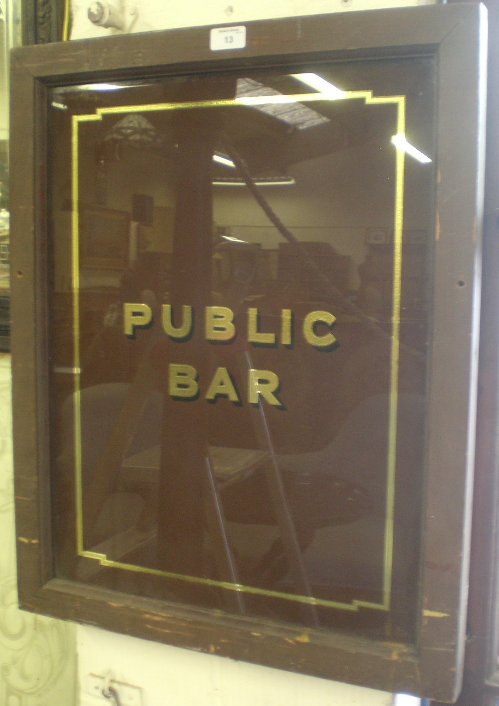A decorated glass panel, `Public Bar`