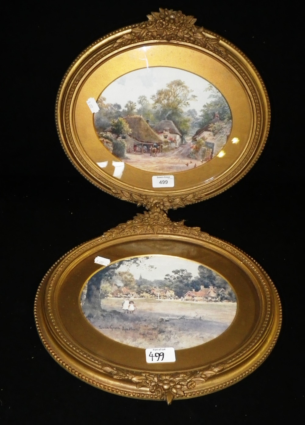 Two Edwardian colour prints of rural village scenes in oval gilt frames