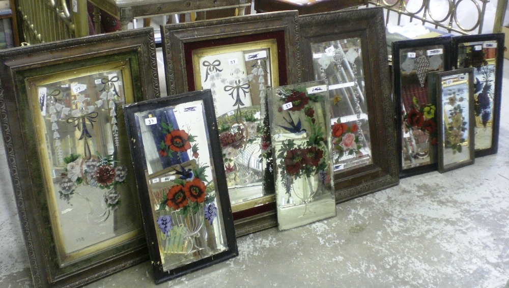 A collection of pub mirrors and glasses, a number decorated with painted scenes of birds amongst