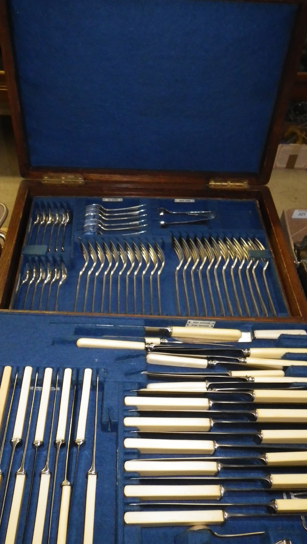 A large Walker & Hall oak canteen containing a large quantity of plated cutlery