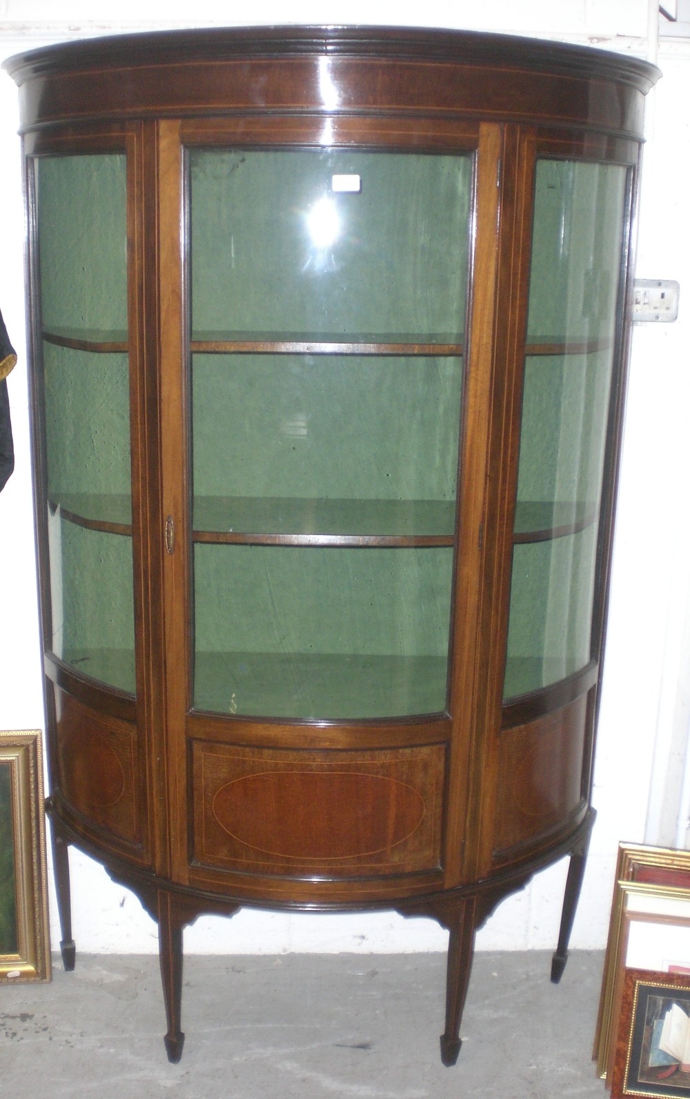 An Edwardian mahogany and line inlaid bow fronted glazed display cabinet