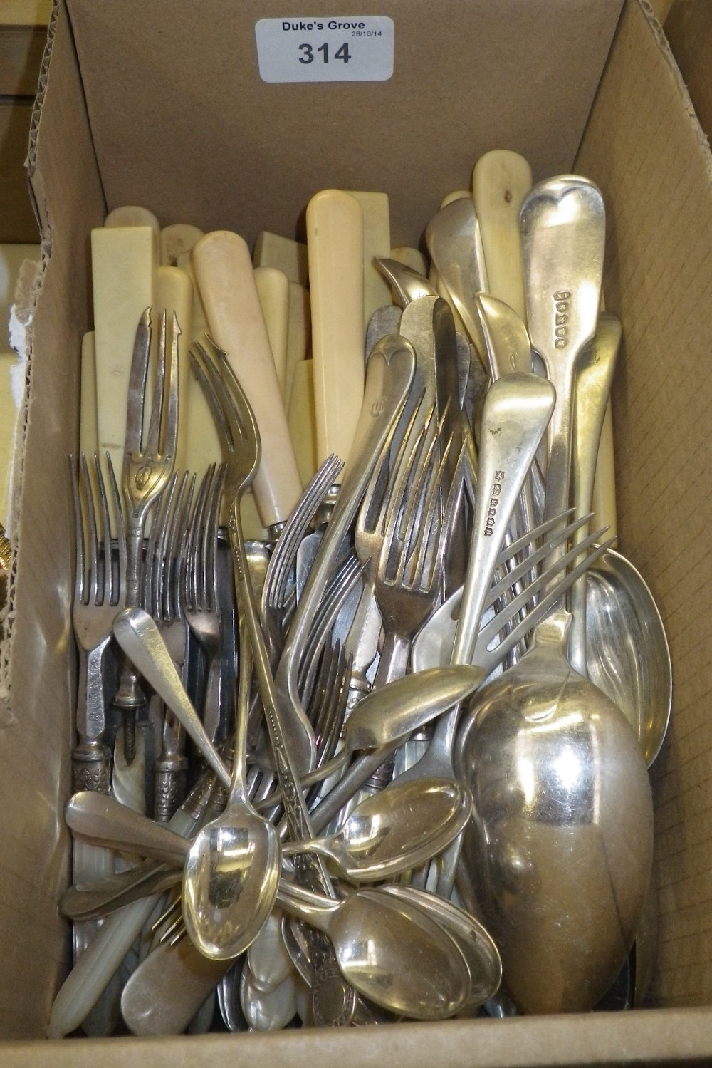 A quantity of assorted cutlery including spoons, forks and knives