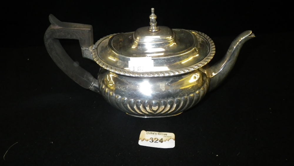 A London silver bachelor`s teapot with stop-fluted decoration