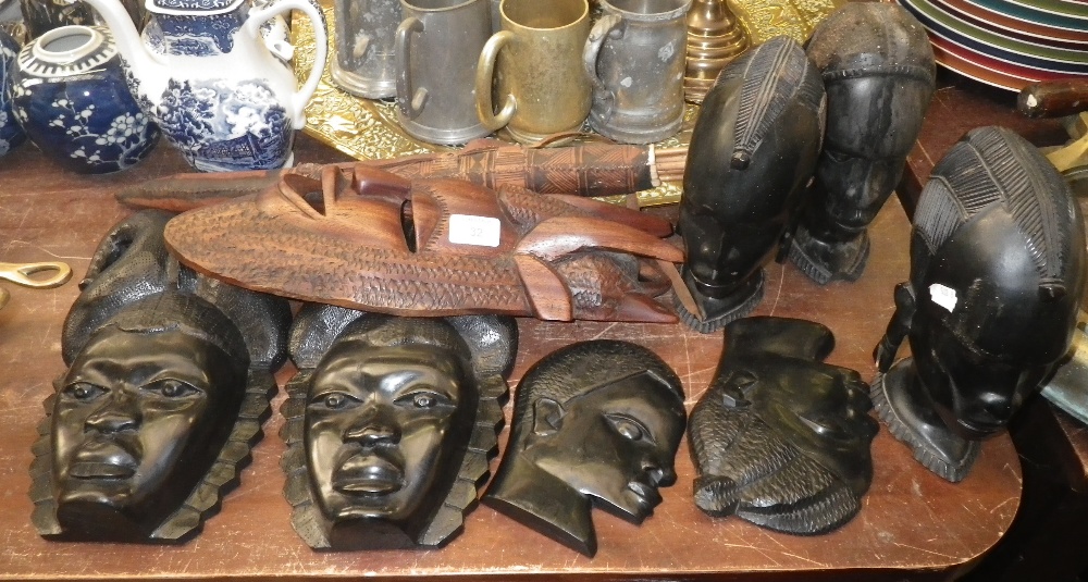 A collection of African carvings and similar items