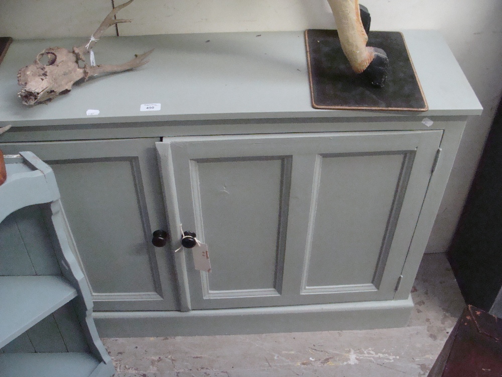 A grey painted pine cupboard, twin panelled doors