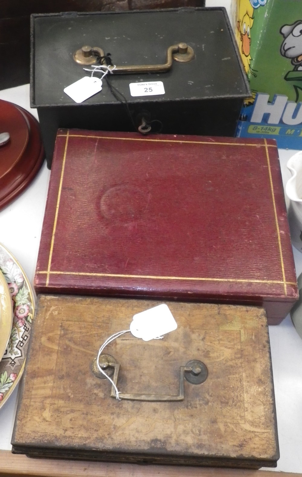 A 19th century red leather covered writing slope and two vintage cash boxes