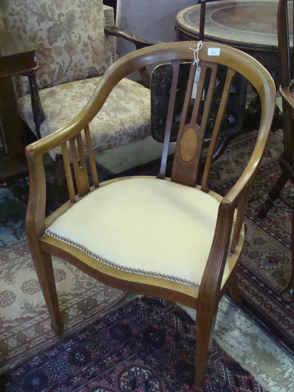 An Edwardian mahogany tub chair