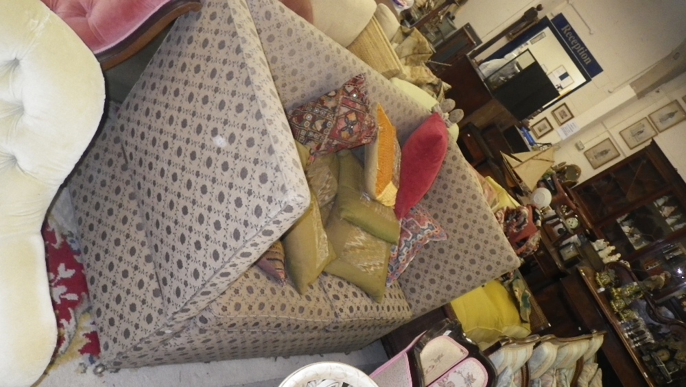 A Knole two seater sofa with blue floral upholstery on beige ground and a selection of various