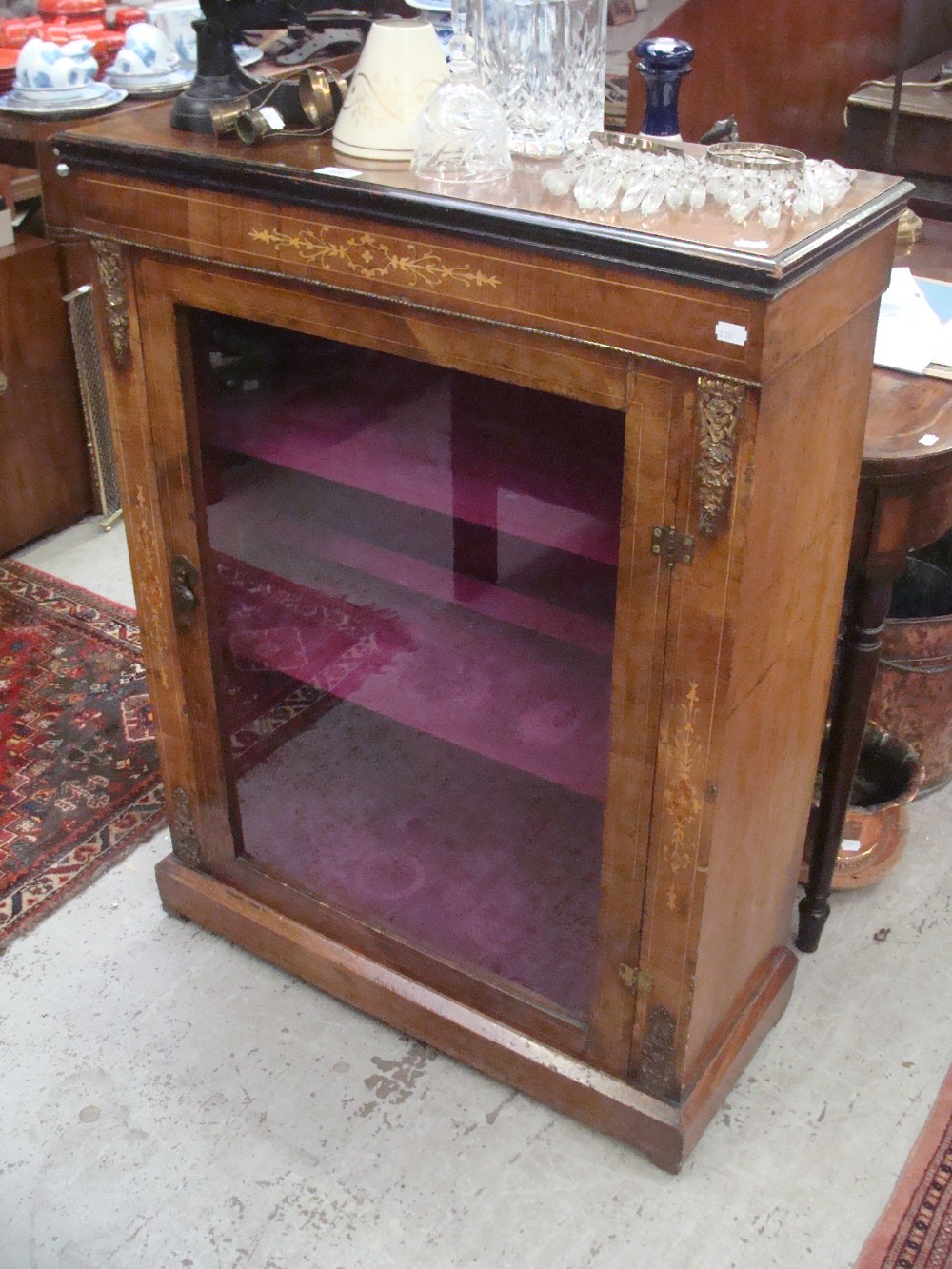A Victorian walnut and marquetry inlaid display cabinet with ormolu fittings