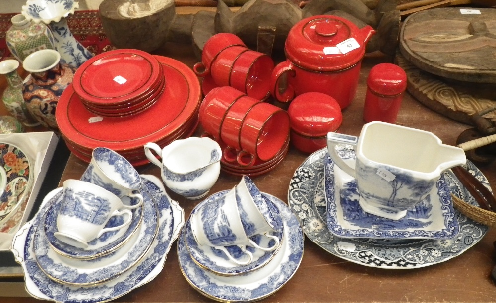 A blue and white teaset with gilt border, a red glazed 1970`s dinner and teaset and similar