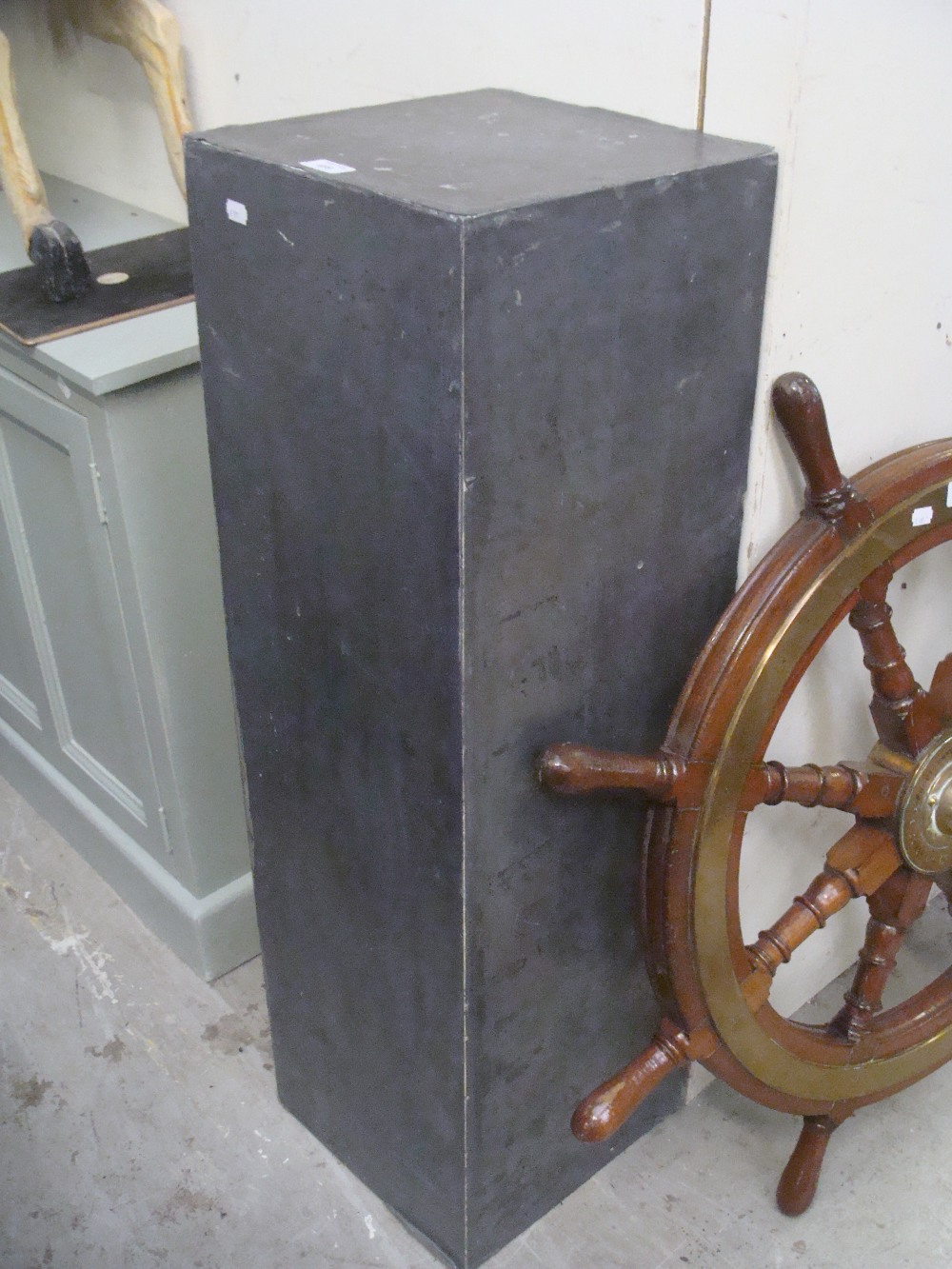 A pair of pewter covered display columns of square form