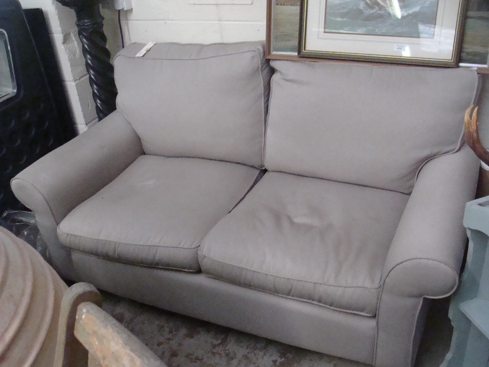 A contemporary two seater Laura Ashley sofa, upholstered in grey material