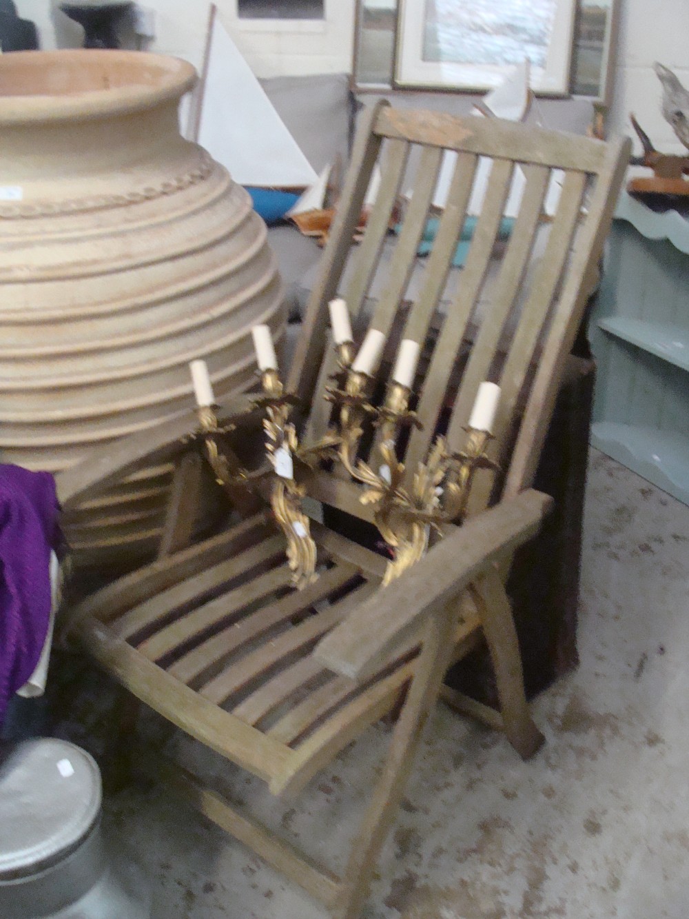 A pair of adjustable slatted garden chairs