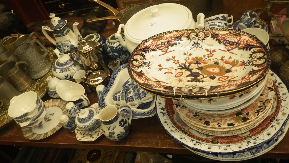 A collection of `Willow` pattern teaware and similar decorative ceramics