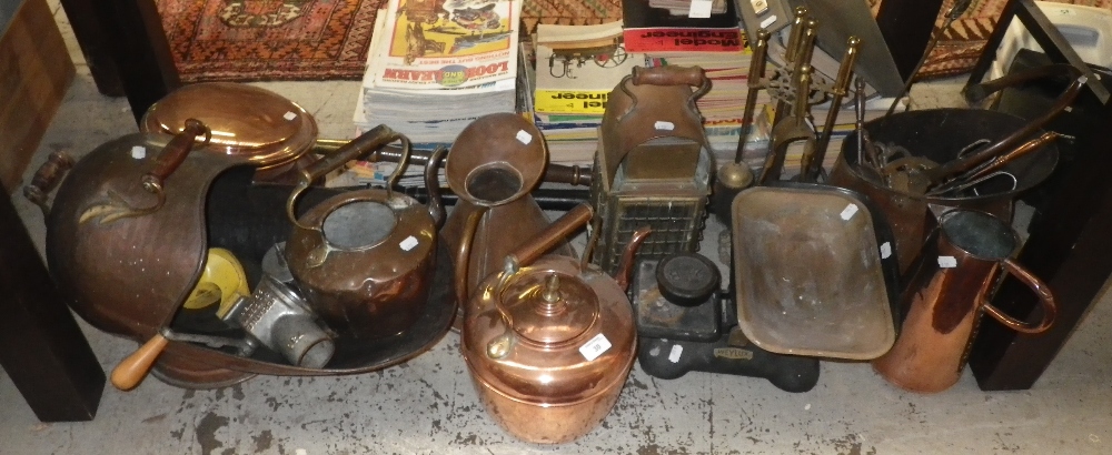 A copper helmet coal scuttle, two brass kettles, a hand held lantern and similar items