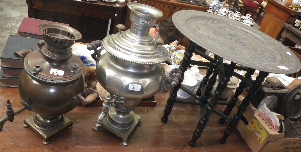 A copper samovar, another similar and a small tray-topped Persian table