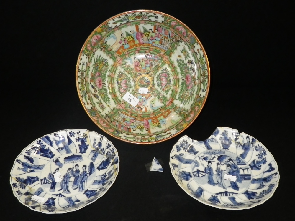 A Cantonese bowl decorated with coloured enamels, together with a pair of blue and white plates