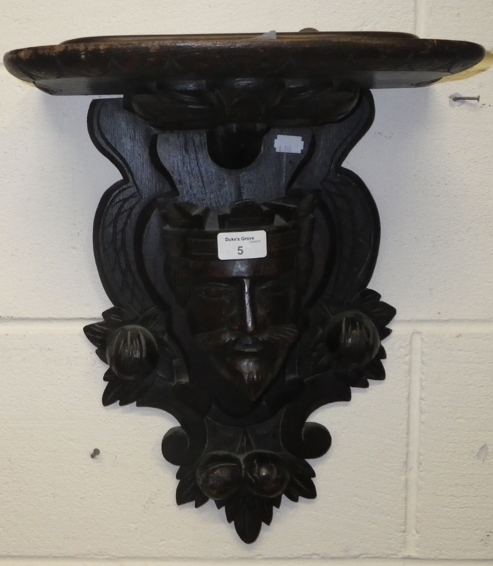A Victorian carved oak wall bracket, the corbel in the form of a king`s head